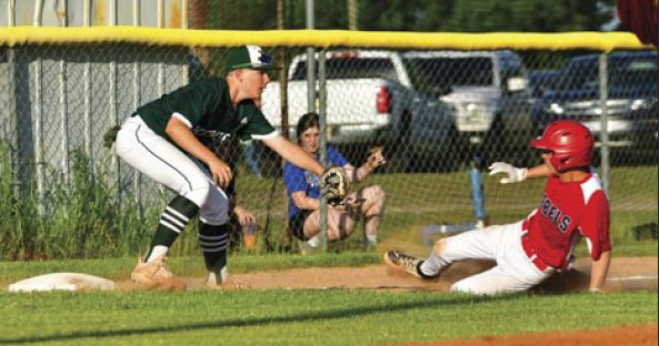 Kemper Academy third baseman Casen Holmes tags out a North Sunflower base runner in playoff action in April.